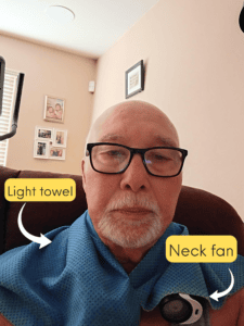 Image of Bob Alvord with his cooling towel and rechargeable neck fan combo